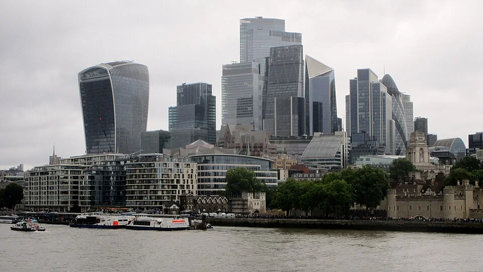 City of London skyline across the Thames from the Queen’s Walk, including the curved Walkie Talkie tower.